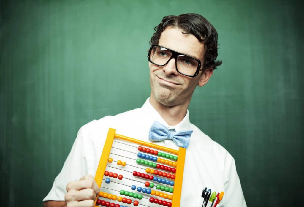 What Does the Average Canadian’s TFSA Look Like at 55? man in bowtie poses with abacus