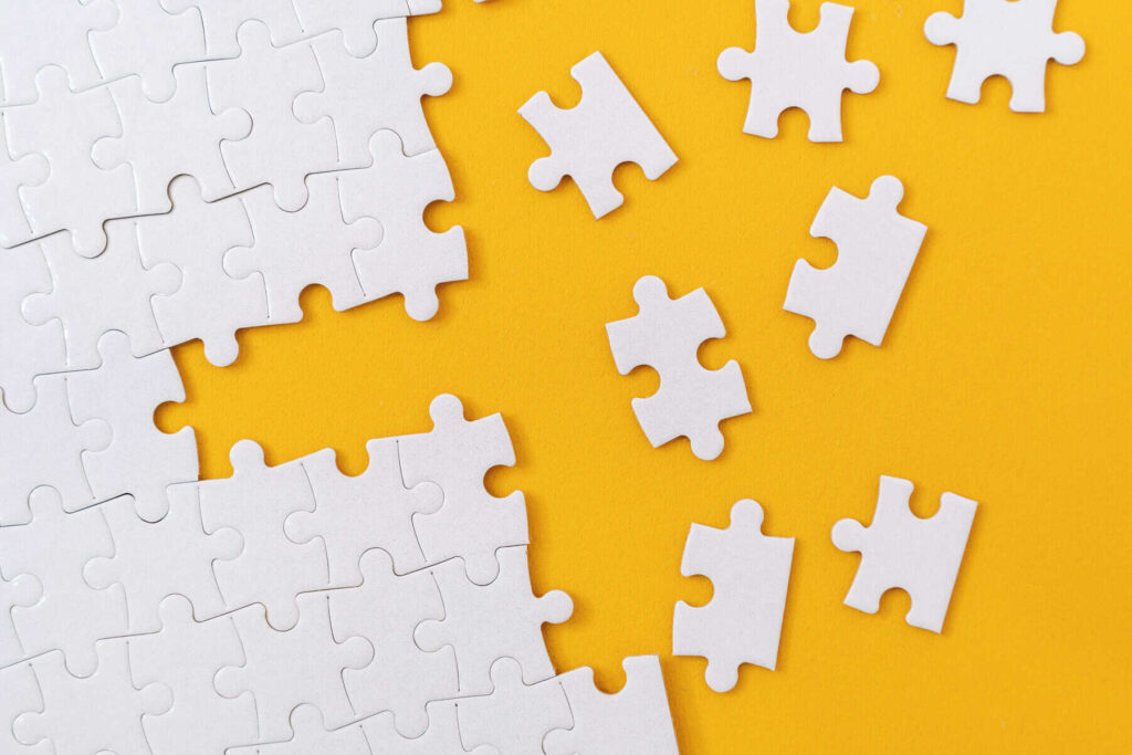 How I’m Structuring My $7,000 TFSA for Steady Monthly Payouts Partially complete jigsaw puzzle with scattered missing pieces