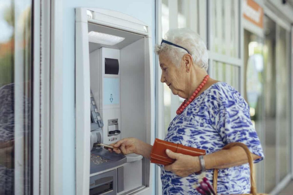 Your GIC Is Maturing as Rates Rise: I Wouldn’t Automatically Lock It Up Again customer uses bank ATM
